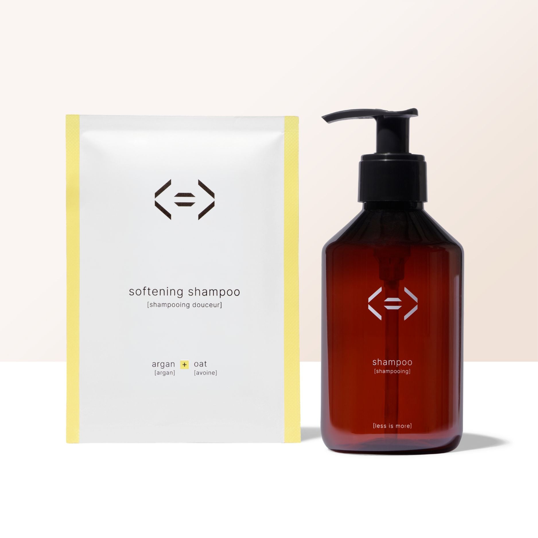 Less is more shampoo bottle with pump and white box labeled 'softening shampoo' on a beige background